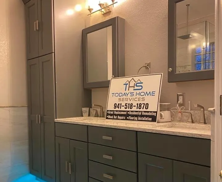 Dark double vanity with mirror and under-cabinet LED lighting