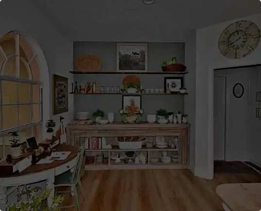 Dining nook with built-in shelving and wood flooring