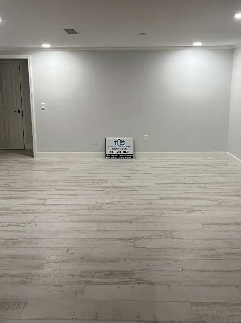 Empty room with newly installed wood-look flooring
